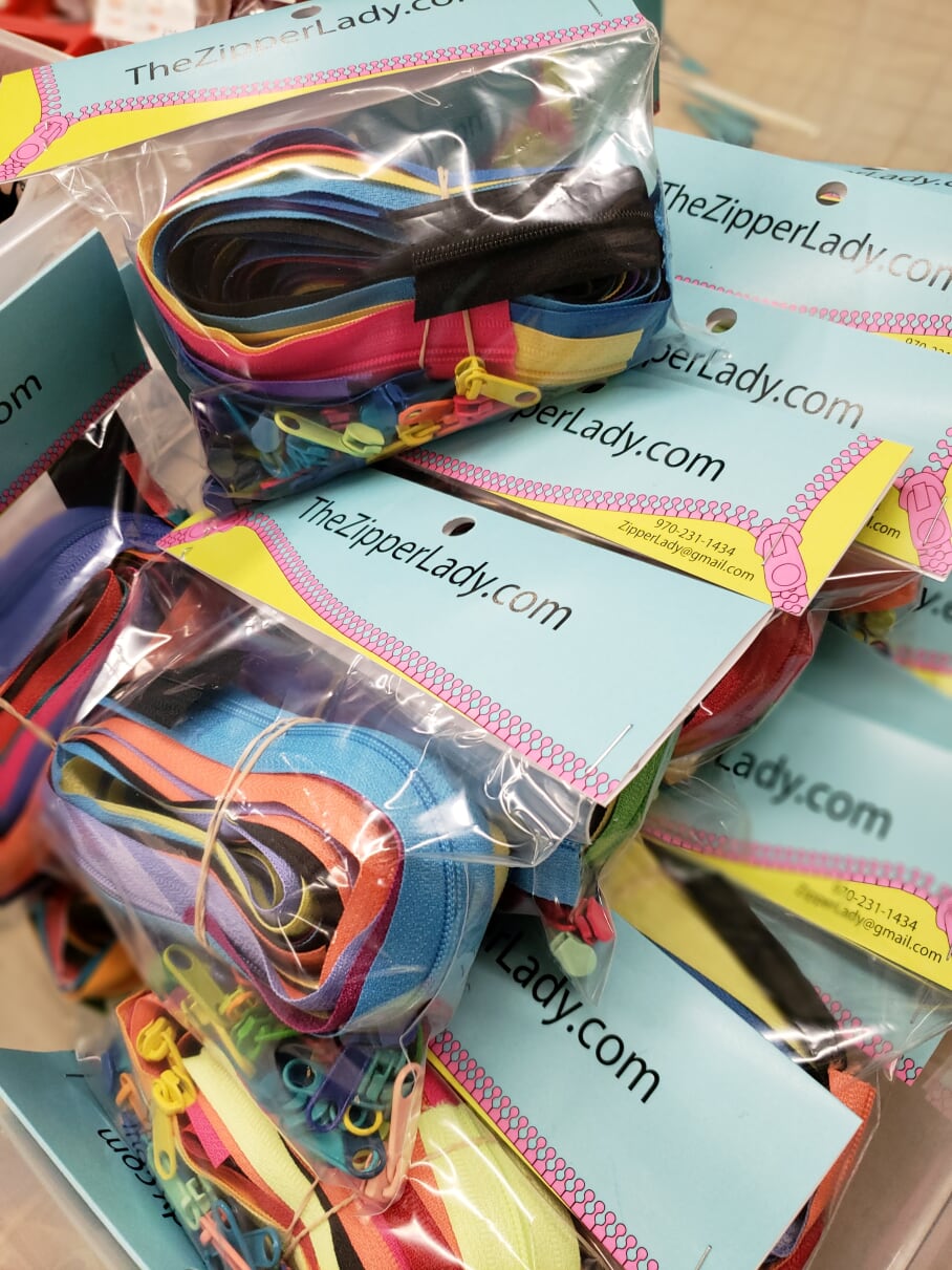 Bags of colorful zippers